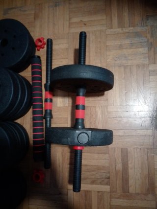 Lote de discos y barras regulables.