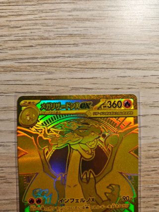 Carta Pokémon Mega Charizard X EX Dorada