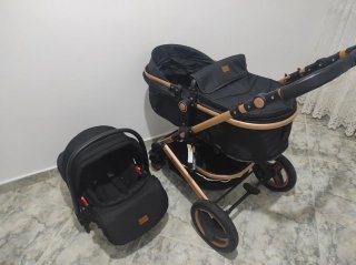 Carro de bebé negro y bronce