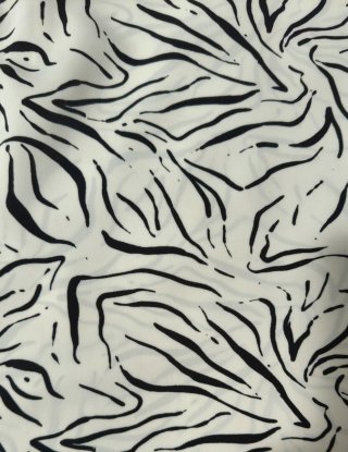 Top fluido con estampado abstracto