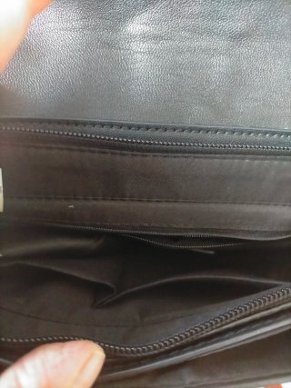 Bolso de mano negro con trenzado