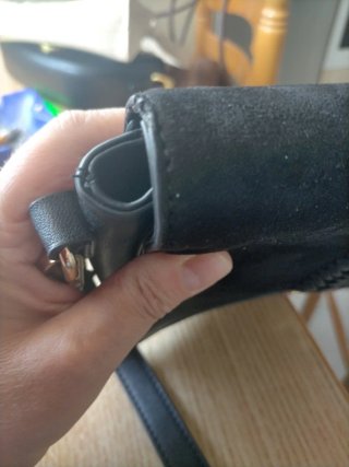 Bolso de mano negro con trenzado