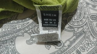 Top calado verde con lazada