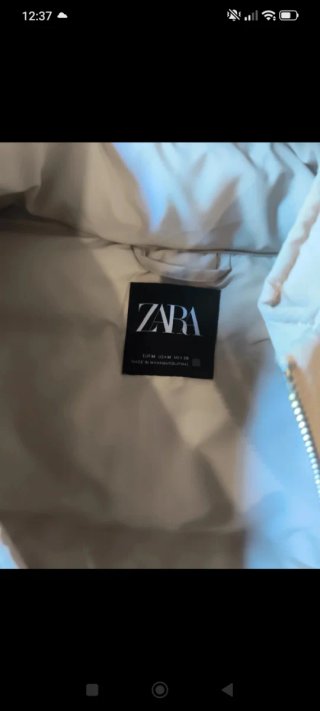 Chaleco largo Zara beige con capucha