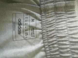 Pantalón corto Adidas gris adulto