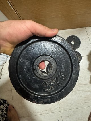 Mancuernas y discos de hierro