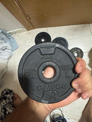 Mancuernas y discos de hierro