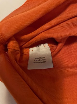 Polo Hermes arancione con taschino