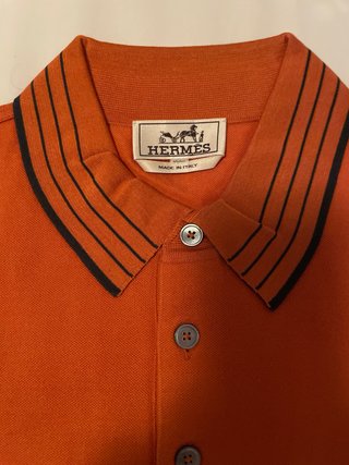 Polo Hermes arancione con taschino