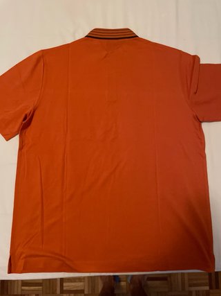 Polo Hermes arancione con taschino