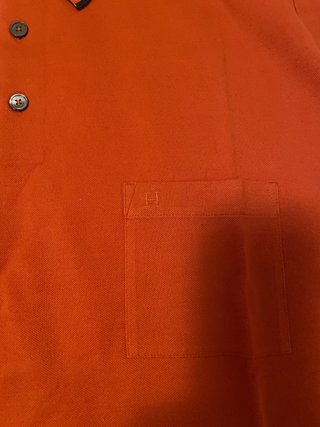 Polo Hermes arancione con taschino