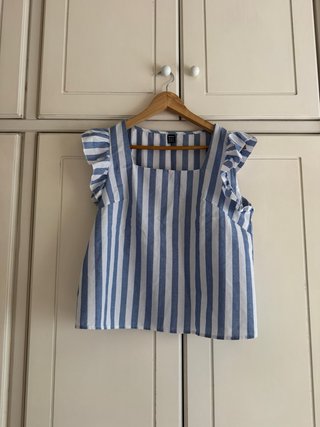 Blusa sin mangas a rayas azules y blancas