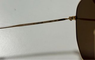 Gafas de sol Ray-Ban doradas y marrones