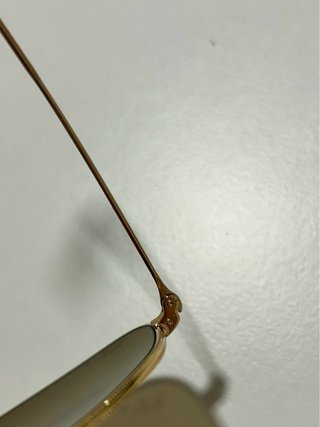 Gafas de sol Ray-Ban doradas y marrones