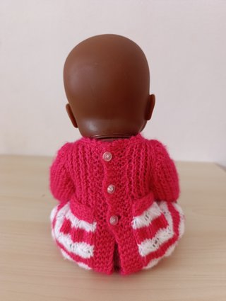Muñeca Bebé Africana + Orinal Musical Rosa