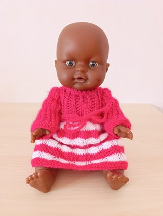 Muñeca Bebé Africana + Orinal Musical Rosa
