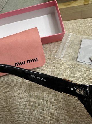 Occhiali da sole Miu Miu neri da donna
