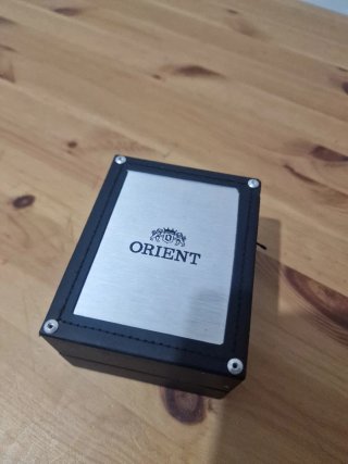 Reloj Orient Naranja y Plateado