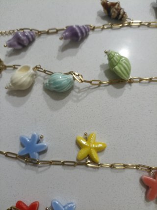 Pulseras acero y cerámica con conchas y estrellas