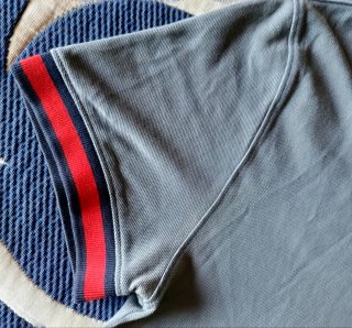 Polo Tommy Jeans.Gris Talla M