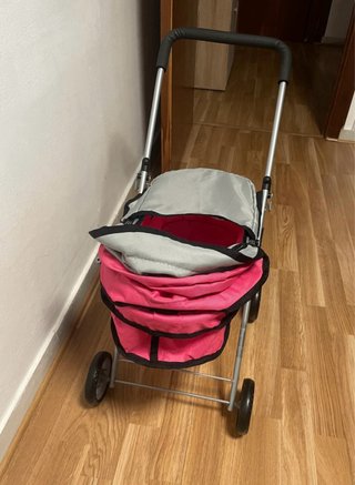 Carrito de bebé de juguete rosa y gris