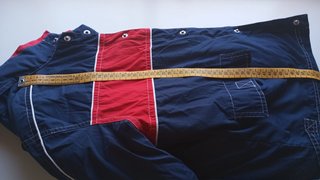 Chaqueta cortavientos niño azul y rojo