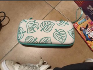 Nintendo Switch OLED Bianca + Custodia + 2 giochi