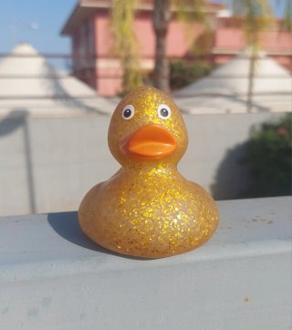 Scintillante paperella in gomma glitterata oro