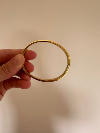 Pulsera dorada con ojos multicolor