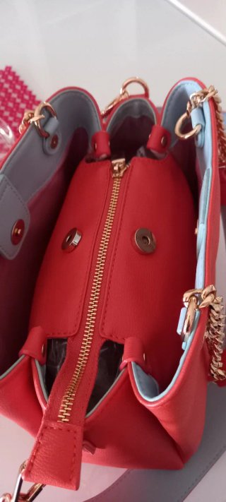 Borsa Gaudi arancione con dettagli oro