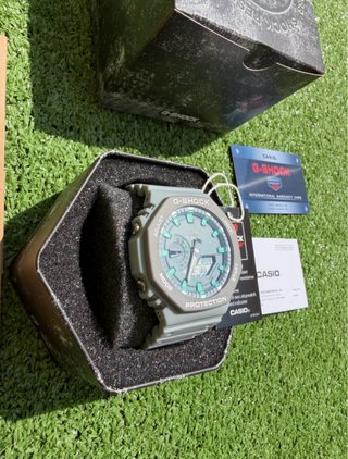 Reloj G-Shock Gris y Turquesa