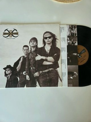 Vinilo y Álbum Fotos Héroes del Silencio