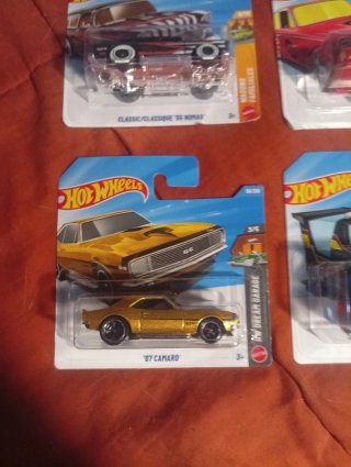 Lote 4 coches Hot Wheels: Camaro, Lotus, Nomad, Ra