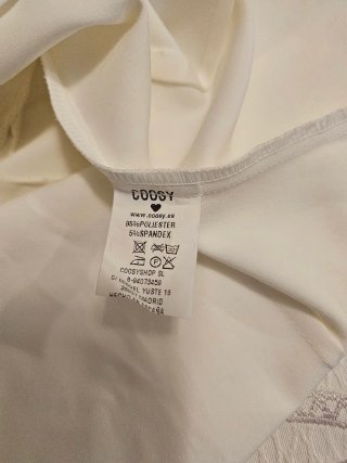 ​Top asimétrico blanco Coosy - Manga abullonada (T