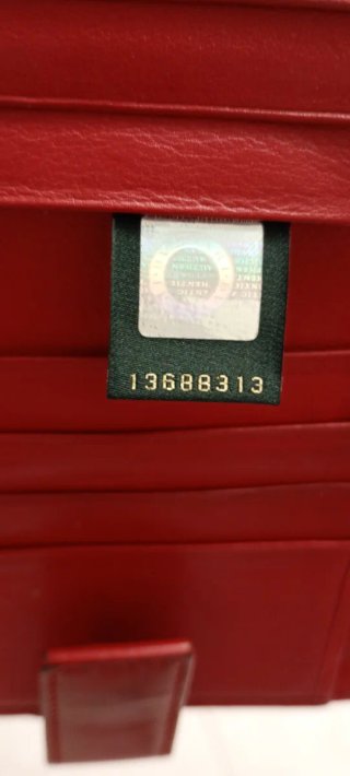 Portafoglio donna Bulgari rosso con cerchio dorato