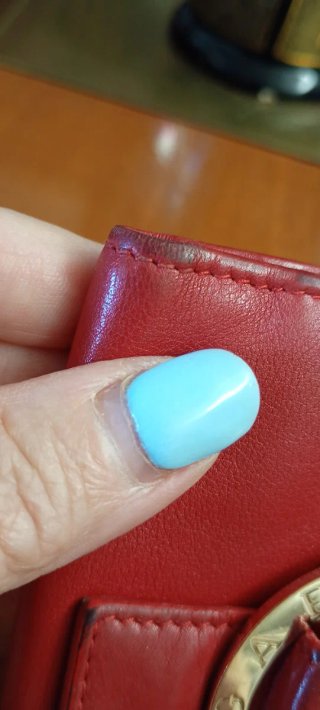 Portafoglio donna Bulgari rosso con cerchio dorato