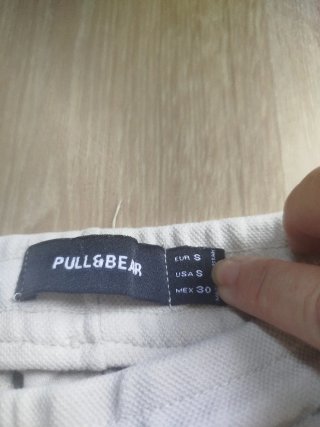 Pantalones largos beige y grises