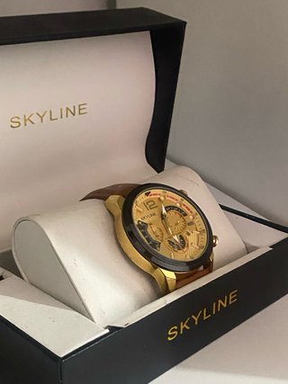 Reloj Skyline Dorado y Marrón