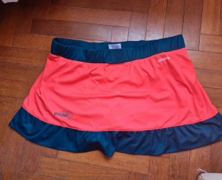 Falda pantalón pádel Adidas naranja y verde