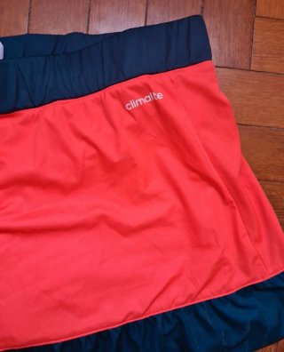 Falda pantalón pádel Adidas naranja y verde