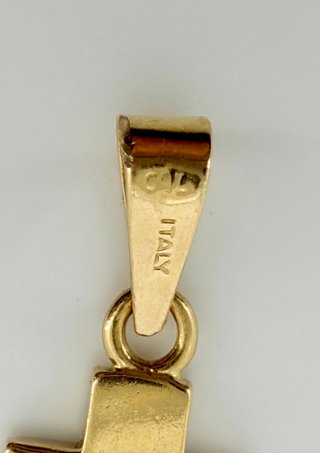 Colgante Cruz de oro de 18k, 0.93 g.
