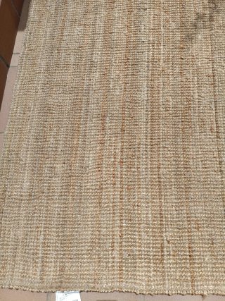 Alfombra de yute beige y marrón