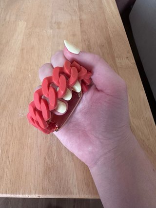 Pulsera Bimba y Lola dorada y goma naranja