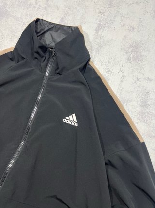 Chaqueta teack jacket Adidas negra y naranja