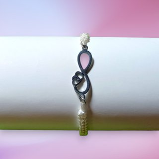 Pulseras infinito acero hilo de algodón.
