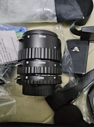Mochila, teleobiettivo e filtri per fotocamera reflex