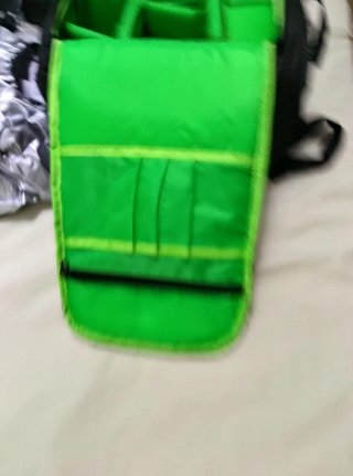 Mochila, teleobiettivo e filtri per fotocamera reflex