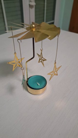 Portavelas giratorio estrellas doradas
