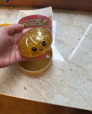 Raviolo Squishy Oro Glitter