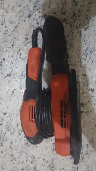 Lijadora eléctrica naranja y negra